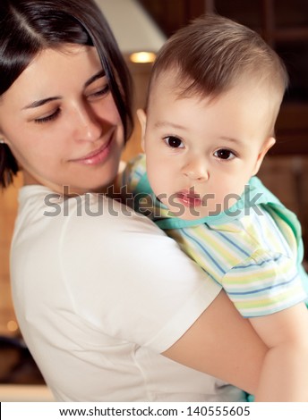 nice boy with mother, little baby with mommy, pretty woman and cheerful child play game, happy smiling young lady hugging son, new family and love concept