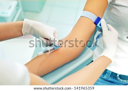 the nurse is going to loosening a tourniquet during the injection