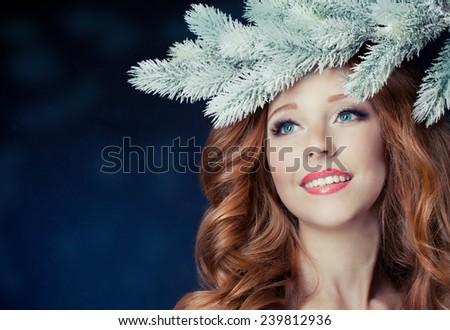 Christmas beauty woman.Holiday make up . False eyelashes,art christmas adornment. Copy space for your text