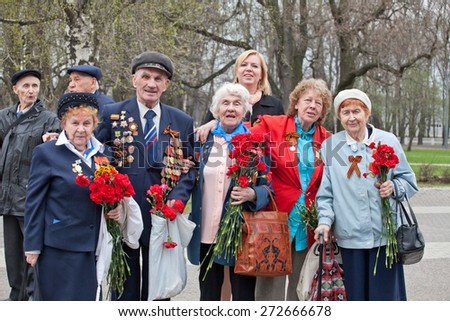Saint Petersburg /RUSSIA - MAY 9: Old   veterans of  WWII  decorated with  medals   during festivities devoted to anniversary of Victory Day on May 9, 2013 in Saint- Petersburg