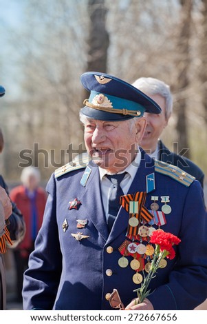 Saint Petersburg /RUSSIA - MAY 9: Old   veterans of  WWII  decorated with  medals during festivities devoted to anniversary of Victory Day on May 9, 2013 in Saint- Petersburg