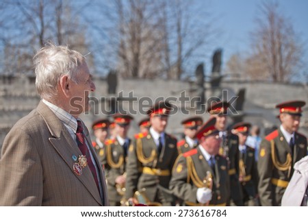 Saint Petersburg /RUSSIA - MAY 9: Old   veterans of  WWII  ,  young boy and sailor   during festivities devoted to anniversary of Victory Day on May 9, 2013 in Saint- Petersburg. Three generations