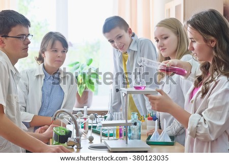 Schoolchildren  in science class