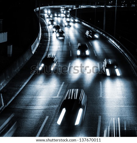 cars on a highway by night