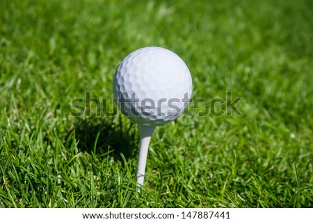 golf ball on green meadow
