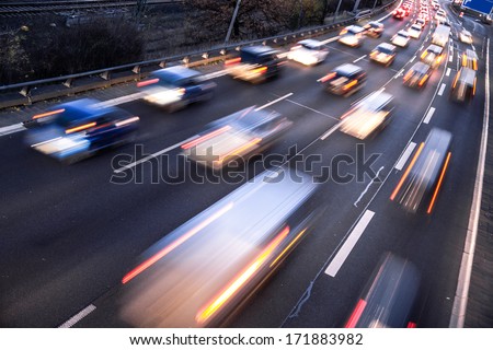 Fast Cars On Highway In Evening Light