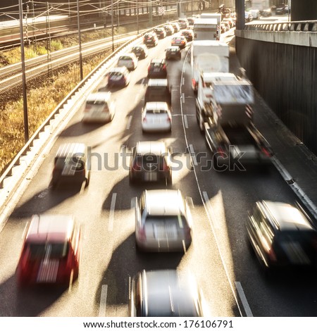 cars on highway in sunlight