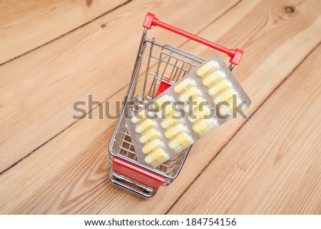 medicines in a shopping cart