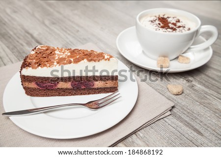 cake and coffee on wood table