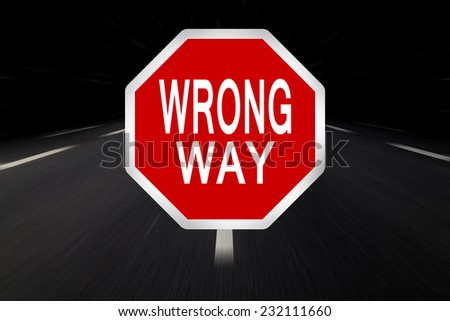 wrong way written on traffic sign