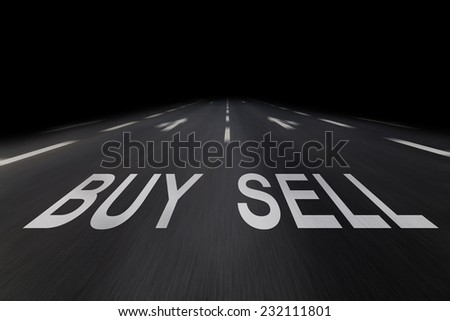 buy and sell written on asphalt
