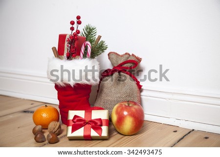 Santa Boots (St. Nikolaus) on wooden floor, vignette