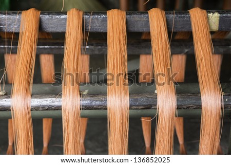 Red strings on textile machine