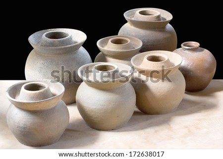 Clay pottery ceramics on black background