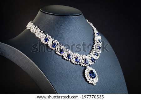 diamonds with dark blue sapphire necklace on the black background