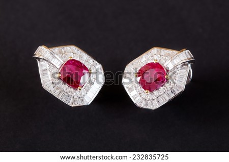 Diamonds Earring with ruby gem in black background