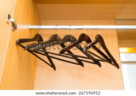Coat hangers on clothes rail