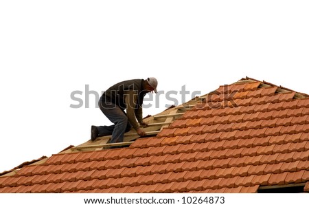 construction workers repairing roof