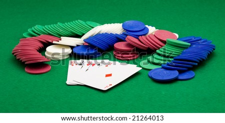 poker cards and chips on green table