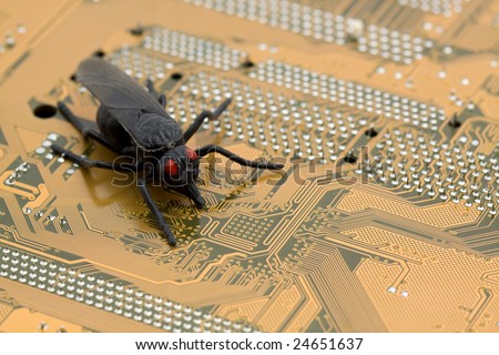 computer bug concept - bug on a motherboard