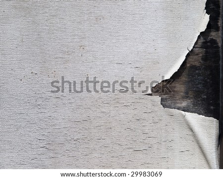 Grungy wall paper texture. Torn and aged  white wallpaper on wood.