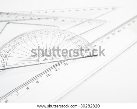 ruler, triangular rule, protractor on white background