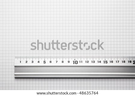 Ruler aligned to a scaled paper. For showing actual size of a object