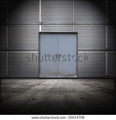 Classified room. Facility or Base type of grungy interior, with metal door and wall and concrete floor.