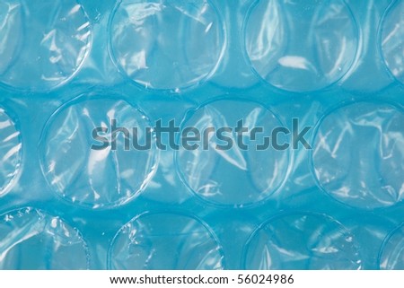 Blue plastic bubble wrap texture. high magnification.