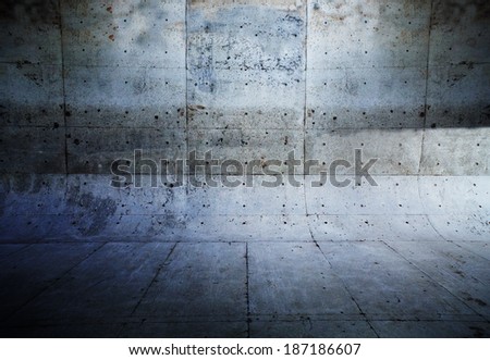 Grungy concrete wall and floor with rounded corners.