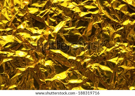 gold abstract background. Gold paper with wrinkles.