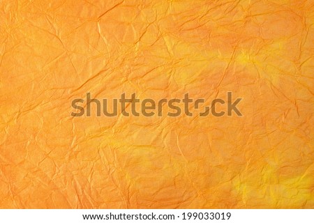Orange hand dyed paper texture.