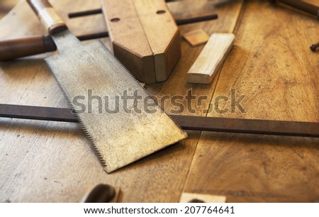 Wood working. Saw, clamps and old wooden boards.