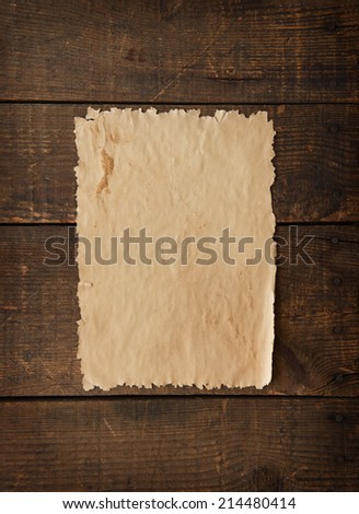 Old west type of blank poster or paper on a old wooden wall.
