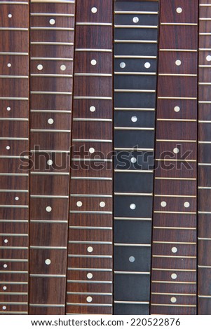Guitar necks aligned, Rosewood, and ebony fingerboard necks