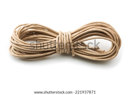 Batch or roll of brown packaging cord or twine, isolated on white.