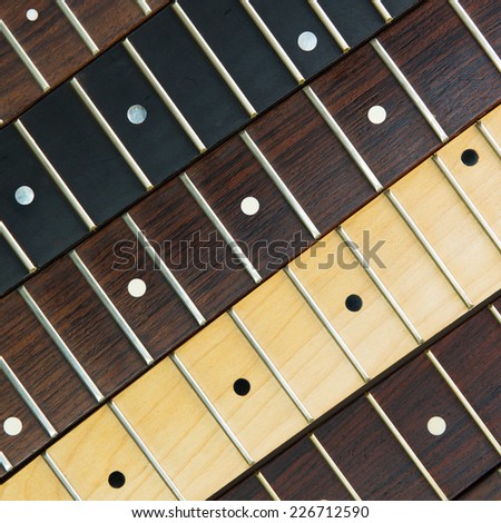 Guitar necks aligned, Rosewood, maple and ebony fingerboard necks