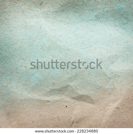 Retro paper background. faded early 1900\'s paper and light blue pigment.
