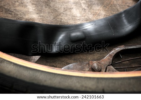 Repairing a flat tire of an bicycle tire. Patched up inner tube of an bicycle tire.