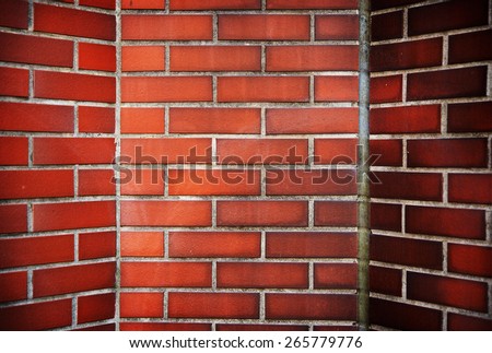 Red brick corner with slanted walls. fireplace or inside a chimney.