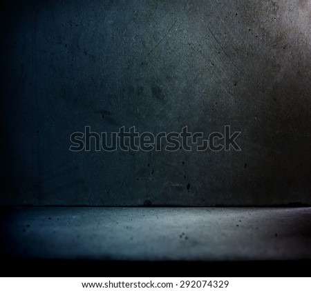 Stone or concrete wall and floor with backstreet like lighting.