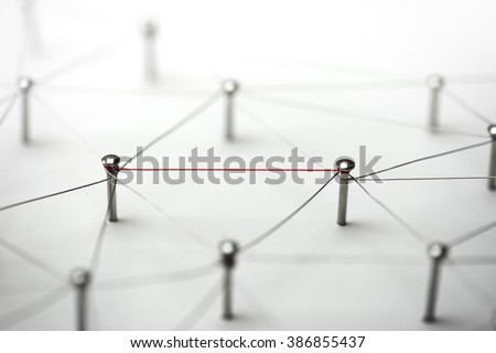 Linking entities. Hotline, high bandwidth.  Network, networking, social media, connectivity, internet communication abstract. Single red wire in a web of silver wires on white background.