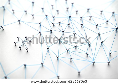 Linking entities. Networking, social media, SNS, internet communication abstract. Small network connected to a larger network. Web of light blue, wires on white background.