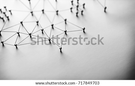 Linking entities. Monotone. Networking, social media, SNS, internet communication abstract. Small network connected to a larger network. Web of black wires of white background.