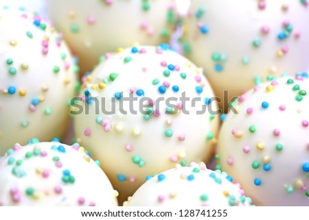 marshmallows white chocolate with variegated sugar sprinkles, food background