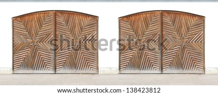 double Garage of a farmhouse, star like carved arched doors, oak wood