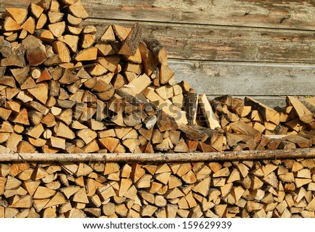 firewood storage on farmstead house front