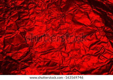 cracked red metallic foil, christmas background