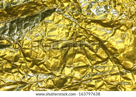 cracked golden metallic foil, christmas background