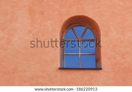 arched window on mediterranean house front, architectural background